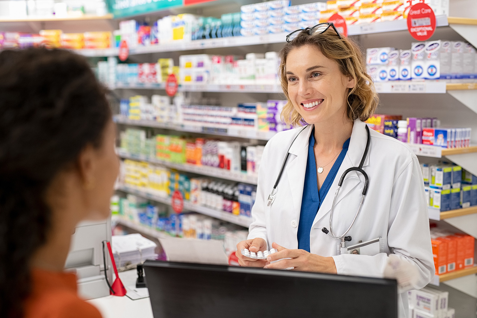 Image of pharmacist in a pharmacy