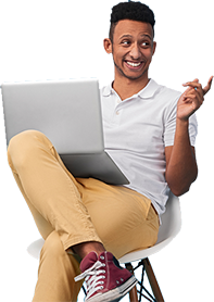 Male sitting on chair with open laptop smiling