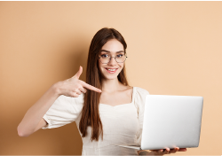 Person pointing at a laptop representing online learning
